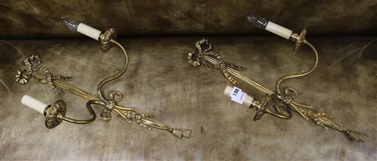 A pair of ormolu ribbon-tied wall lights 61cm.